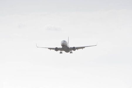 BUCHAREST, ROMANIA - August 15, 2017: Airplane in the cloudy sky.のeditorial素材