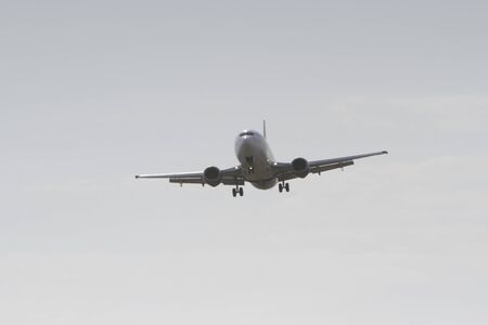 BUCHAREST, ROMANIA - August 15, 2017: Airplane in the cloudy sky.のeditorial素材