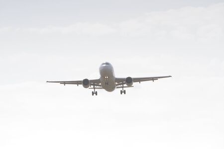 BUCHAREST, ROMANIA - August 15, 2017: Airplane in the cloudy sky.のeditorial素材