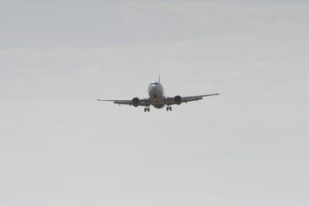 BUCHAREST, ROMANIA - August 15, 2017: Airplane in the cloudy sky.のeditorial素材