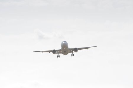 BUCHAREST, ROMANIA - August 15, 2017: Airplane in the cloudy sky.のeditorial素材