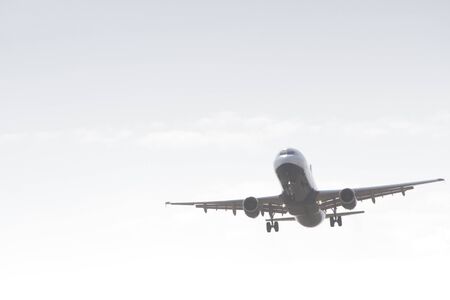 BUCHAREST, ROMANIA - August 15, 2017: Airplane in the cloudy sky.のeditorial素材