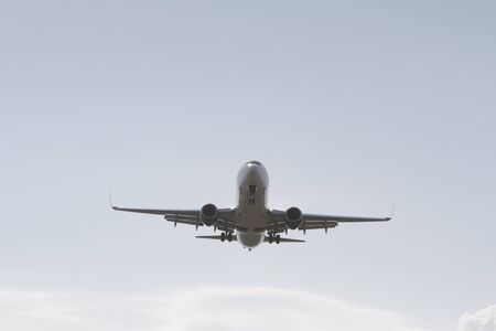 BUCHAREST, ROMANIA - August 15, 2017: Airplane in the cloudy sky.のeditorial素材