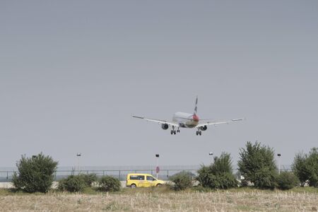 BUCHAREST, ROMANIA - August 15, 2017: Airplane in the cloudy sky.のeditorial素材