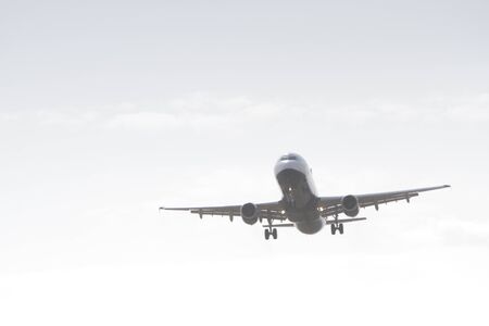 BUCHAREST, ROMANIA - August 15, 2017: Airplane in the cloudy sky.のeditorial素材