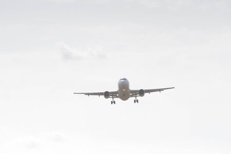 BUCHAREST, ROMANIA - August 15, 2017: Airplane in the cloudy sky.のeditorial素材
