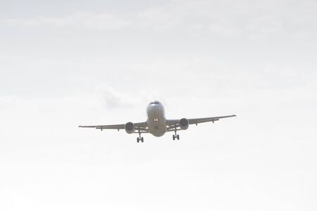 BUCHAREST, ROMANIA - August 15, 2017: Airplane in the cloudy sky.のeditorial素材