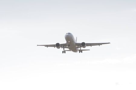 BUCHAREST, ROMANIA - August 15, 2017: Airplane in the cloudy sky.のeditorial素材