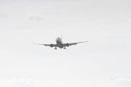 BUCHAREST, ROMANIA - August 15, 2017: Airplane in the cloudy sky.のeditorial素材