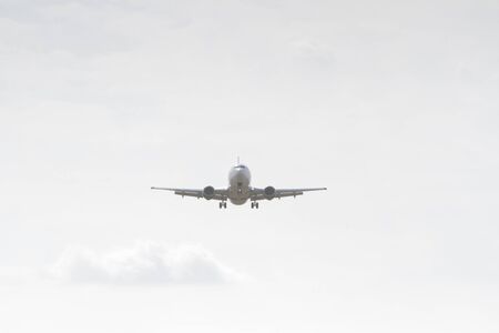 BUCHAREST, ROMANIA - August 15, 2017: Airplane in the cloudy sky.のeditorial素材