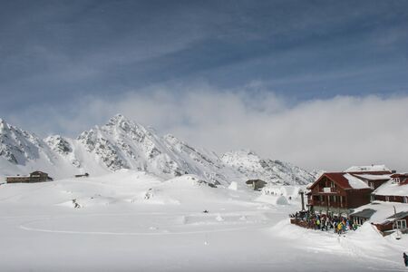 SIBIU, ROMANIA - March 13, 2010: Balea Lake hotel with mountains in the back.のeditorial素材