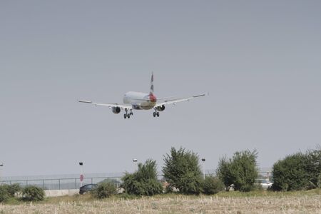 BUCHAREST, ROMANIA - August 15, 2017: Airplane in the cloudy sky.のeditorial素材