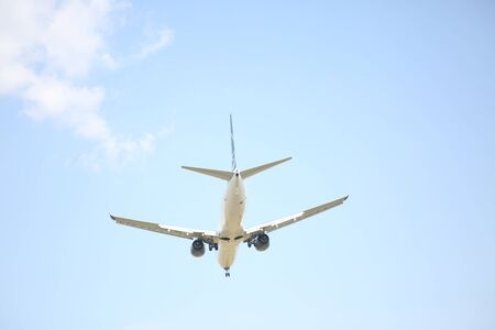 BUCHAREST, ROMANIA - August 15, 2017: Airplane in the cloudy sky.のeditorial素材