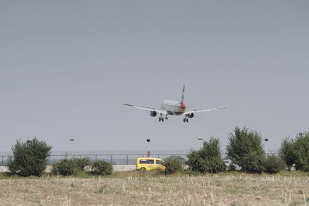 BUCHAREST, ROMANIA - August 15, 2017: Airplane in the cloudy sky.のeditorial素材