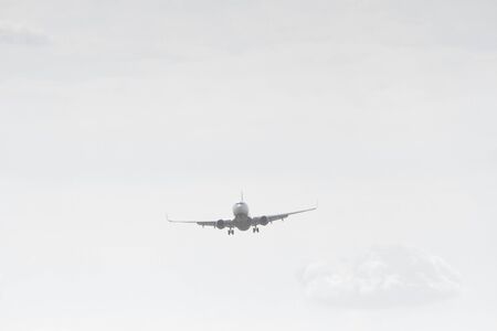 BUCHAREST, ROMANIA - August 15, 2017: Airplane in the cloudy sky.のeditorial素材