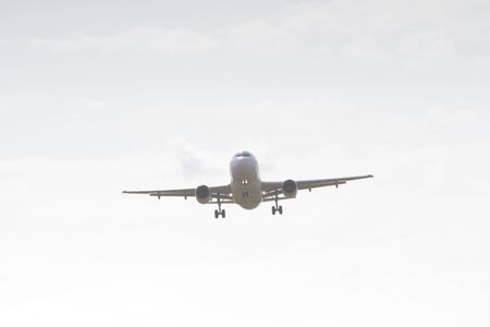 BUCHAREST, ROMANIA - August 15, 2017: Airplane in the cloudy sky.のeditorial素材