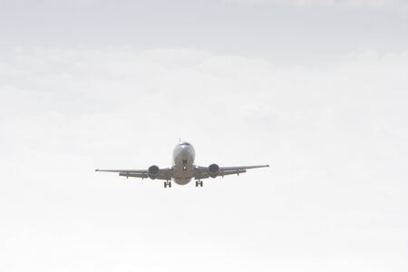 BUCHAREST, ROMANIA - August 15, 2017: Airplane in the cloudy sky.のeditorial素材