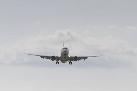 BUCHAREST, ROMANIA - August 15, 2017: Airplane in the cloudy sky.のeditorial素材