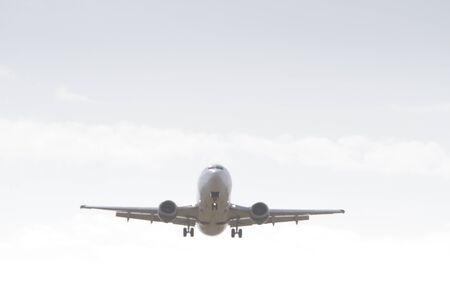 BUCHAREST, ROMANIA - August 15, 2017: Airplane in the cloudy sky.のeditorial素材