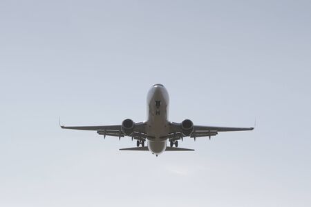 BUCHAREST, ROMANIA - August 15, 2017: Airplane in the cloudy sky.のeditorial素材