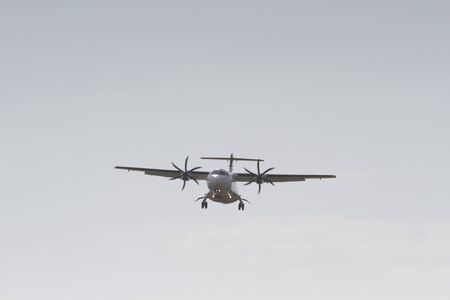 BUCHAREST, ROMANIA - August 15, 2017: Airplane in the cloudy sky.のeditorial素材