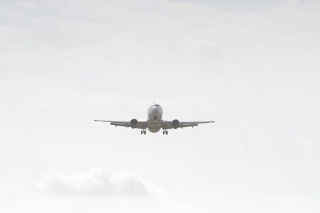 BUCHAREST, ROMANIA - August 15, 2017: Airplane in the cloudy sky.のeditorial素材