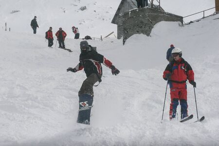 SIBIU, ROMANIA - March 13, 2010: Group of snowboarders at the Balea lake, Fagaras mountains.のeditorial素材
