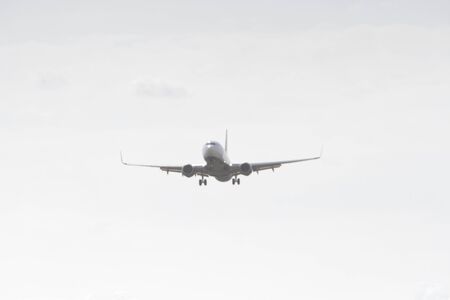 BUCHAREST, ROMANIA - August 15, 2017: Airplane in the cloudy sky.のeditorial素材