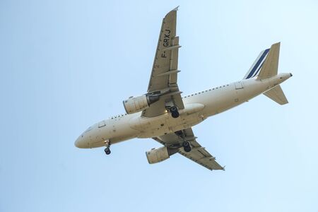 BUCHAREST, ROMANIA - August 15, 2017: Airplane in the cloudy sky.のeditorial素材