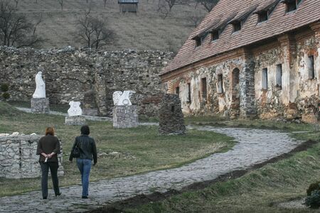 HARGHITA, ROMANIA - March 27, 2010: Architecture detail at the Lazarea Castle. Tourists on the castle alley.のeditorial素材