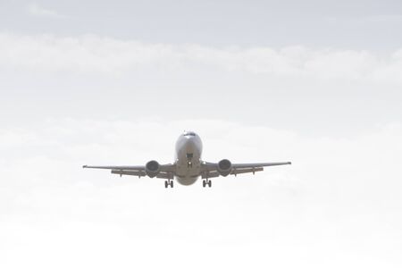 BUCHAREST, ROMANIA - August 15, 2017: Airplane in the cloudy sky.のeditorial素材