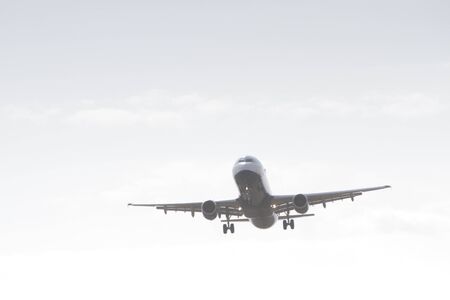 BUCHAREST, ROMANIA - August 15, 2017: Airplane in the cloudy sky.のeditorial素材