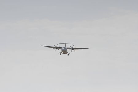 BUCHAREST, ROMANIA - August 15, 2017: Airplane in the cloudy sky.のeditorial素材