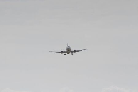 BUCHAREST, ROMANIA - August 15, 2017: Airplane in the cloudy sky.のeditorial素材