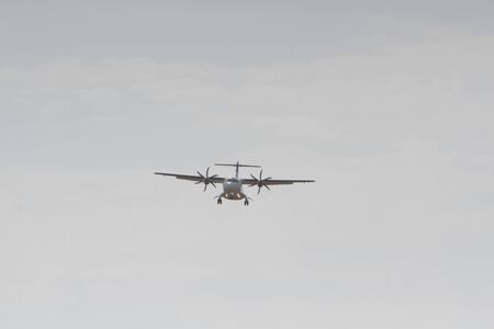 BUCHAREST, ROMANIA - August 15, 2017: Airplane in the cloudy sky.のeditorial素材