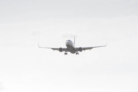 BUCHAREST, ROMANIA - August 15, 2017: Airplane in the cloudy sky.のeditorial素材