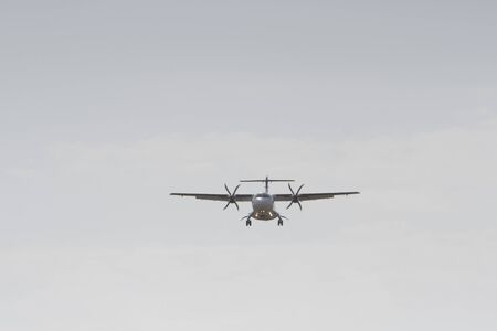BUCHAREST, ROMANIA - August 15, 2017: Airplane in the cloudy sky.のeditorial素材