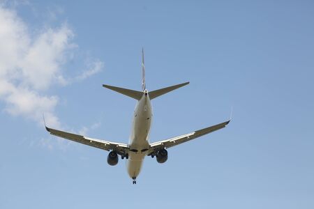 BUCHAREST, ROMANIA - August 15, 2017: Airplane in the cloudy sky.のeditorial素材