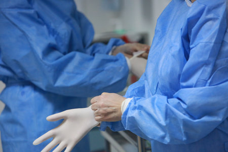 BUCHAREST, ROMANIA - Dec. 27, 2020: Nurses are preparing to administer a dose of the Pfizer-BioNTech COVID-19 vaccine during the first day of European Vaccination Campaign.のeditorial素材