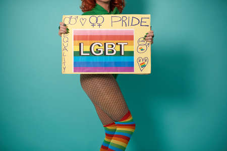 Transgender model with LGBT pride bannerの写真素材