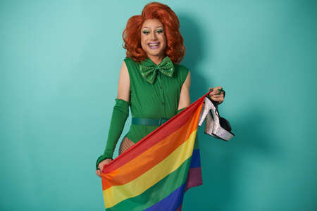 Stylish transgender model with rainbow flag