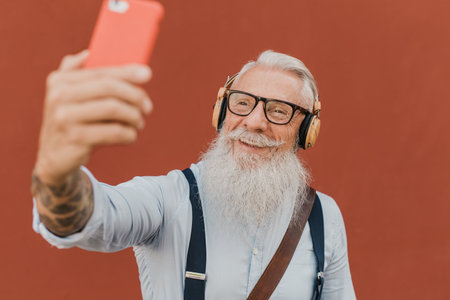 senior man using smartphone for fun