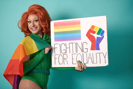Happy drag queen with poster