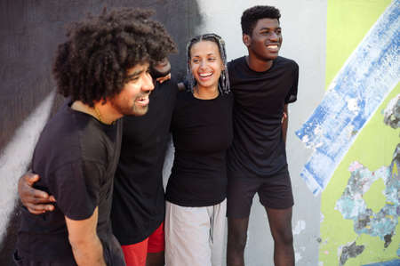 Diverse young friends smiling with positive attitudeの写真素材