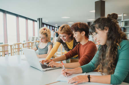 Diverse students working on project together
