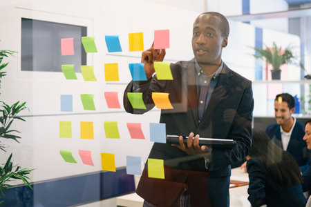 Focused African American businessman in formal suit standing neaの写真素材