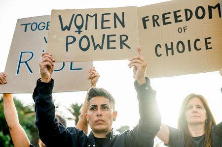 Group of diverse protesters with placards demanding women rightsの写真素材