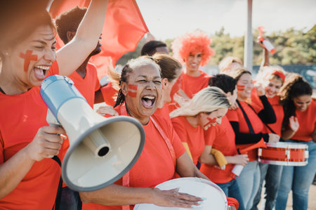 Multiracial group of sports fans celebrate their team victoryの写真素材