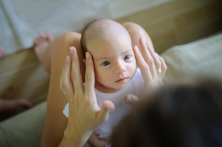 Crop mother with newborn baby
