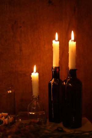 Candles in a dark room with a copy spaceの写真素材